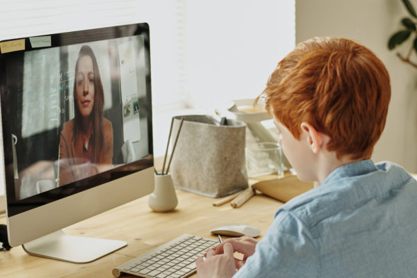 Boy Sitting In Front Of Computer