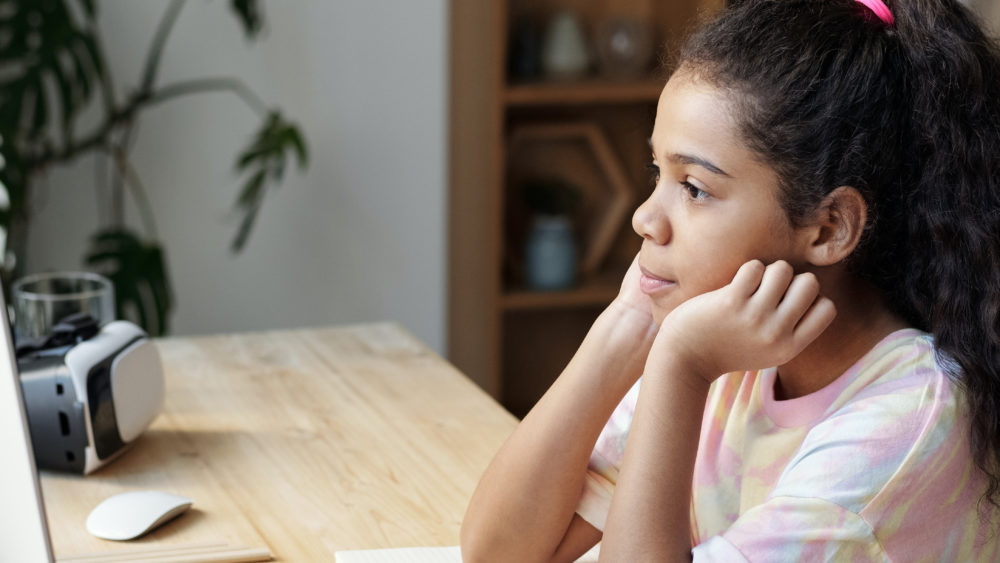 Girl Sitting By The Table