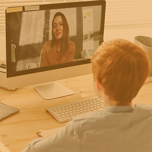 Student interacting with teacher through video chat